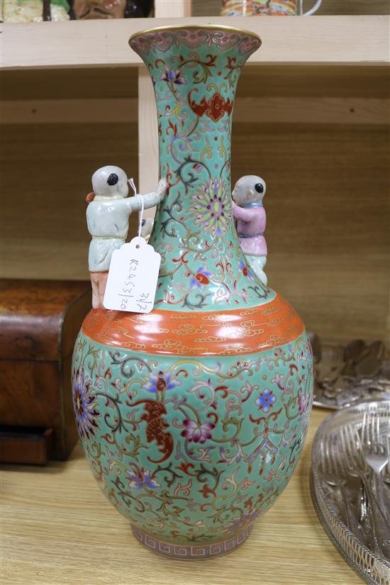A Chinese green ground Boys vase